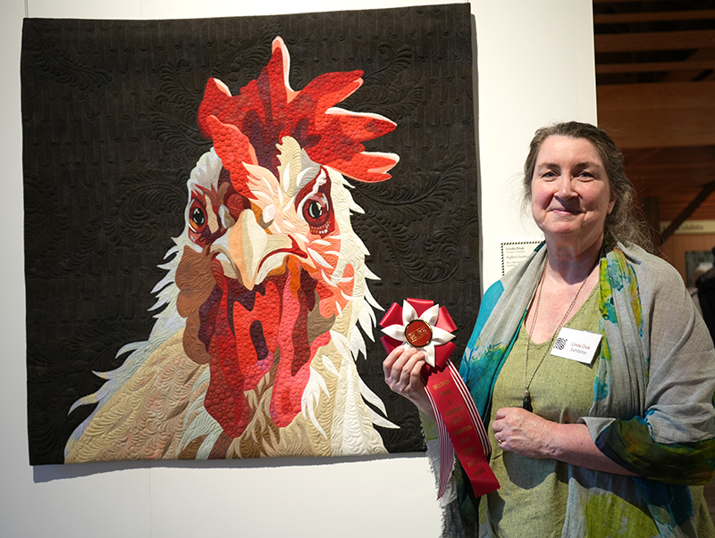 Linda Diak of Chester VT with her quilt Ruffled Feathers copy