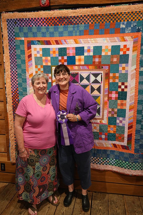 Judge Marti DelNevo of Williston, VT with Rae Heller of Brattleboro, VT with her winning quilt- A Repeated Prayer 600px